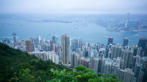 High angle view of buildings in city against sky