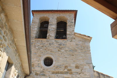 Low angle view of old building against clear sky