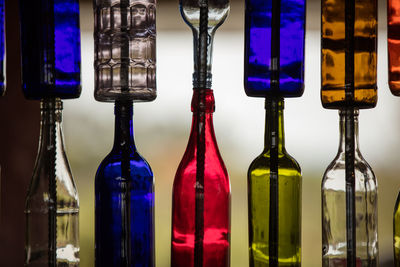 Close-up of illuminated colored bottles 