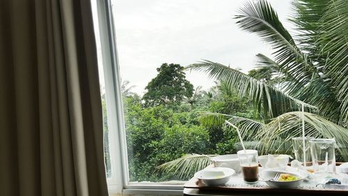 Close-up of coffee cup on table against sky