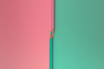 High angle view of pink pencils on table