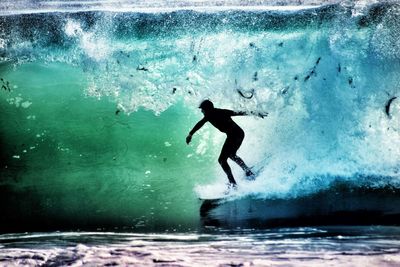 Full length of man surfing in sea
