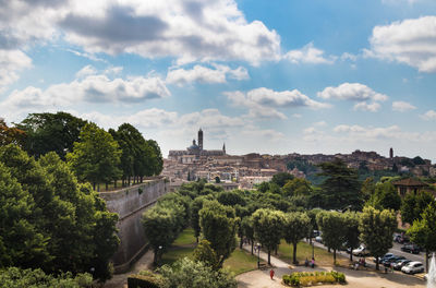 High angle view of trees and buildings against sky