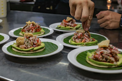 Midsection of man preparing food on table