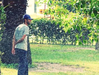 Side view of man walking in park