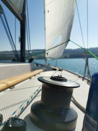 Close-up of sailboat in sea against sky