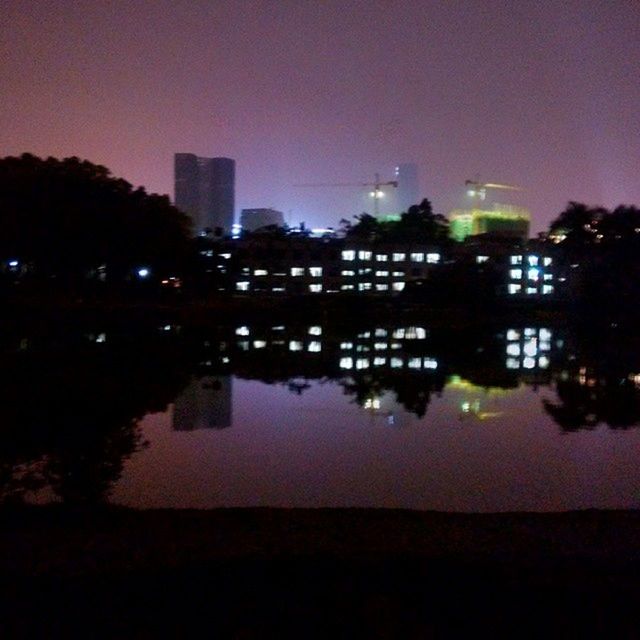 architecture, building exterior, built structure, reflection, illuminated, water, night, silhouette, tree, city, sky, river, dusk, cityscape, lake, no people, sunset, outdoors, growth, dark