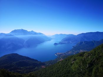 Scenic view of mountains against clear blue sky