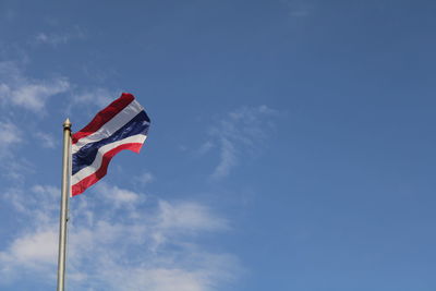 Low angle view of flag against sky