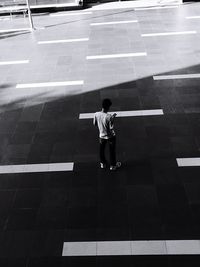 Woman walking on road