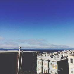 View of buildings against blue sky