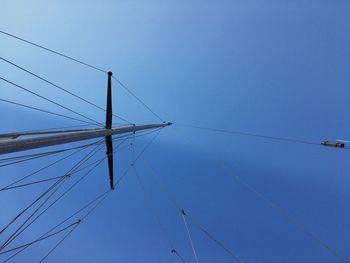 Mast with rigging against the sky