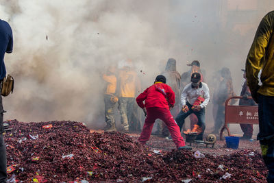 Group of people standing against the wall