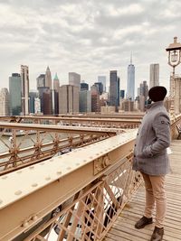 Rear view of woman standing in city