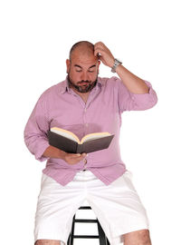 Full length of man standing against white background