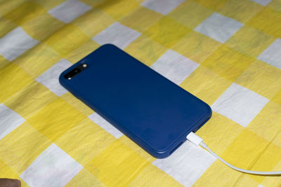 High angle view of mobile phone on table