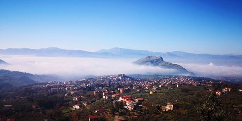 High angle shot of townscape against mountain range