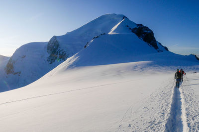 Scenic view of snowcapped mountain against sky