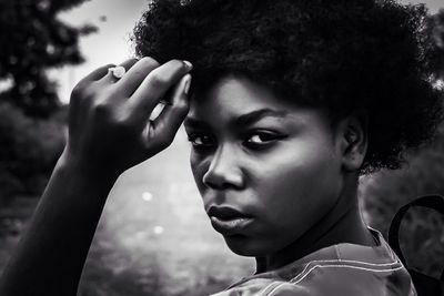 Close-up portrait of young woman with short hair