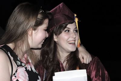 Portrait of woman wearing graduation gown