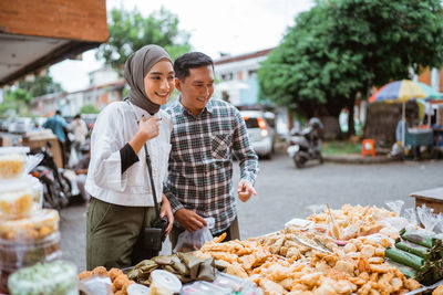 Rear view of man holding food