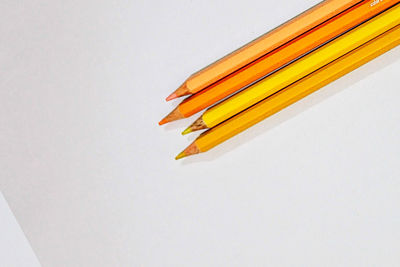 Close-up of pencils against white background