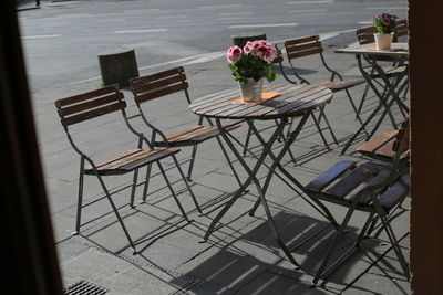 Chairs and table at sidewalk cafe