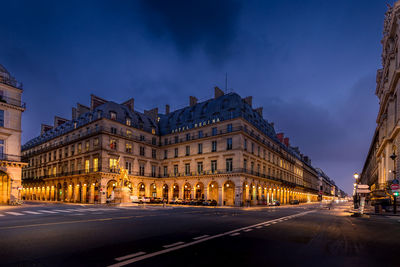 Buildings in city at night