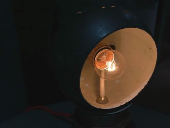 Close-up of illuminated light bulb