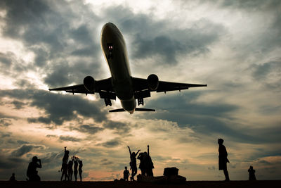 Low angle view of airplane flying in sky