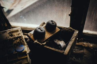 High angle view of abandoned plug on box