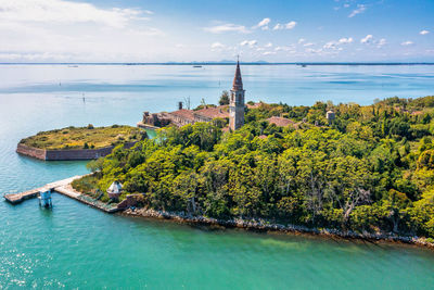 Aerial view of the plagued ghost island of poveglia in venice