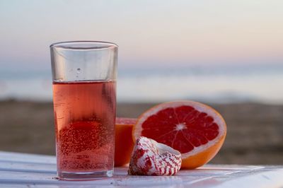 Close-up of orange juice on table