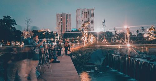 Panoramic view of illuminated city buildings at night