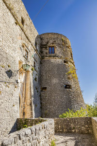 Low angle view of old building against sky