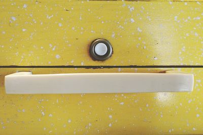 Full frame shot of yellow wooden box