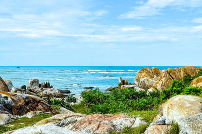 Scenic view of sea against blue sky