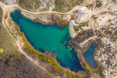 Drone view of industrial opencast mine filled with water. aerial shot of artificial lake