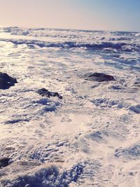 Scenic view of sea against sky during winter