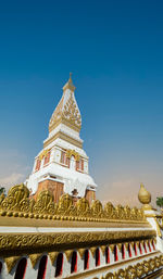 The pagoda of wat phra that panom temple in nakhon phanom in cloudy blue sky day with sunlight