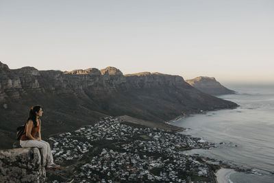 Woman looking at sea from lion's head mountain on weekend