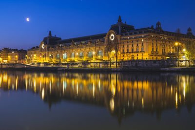 Reflection of buildings in paris at night