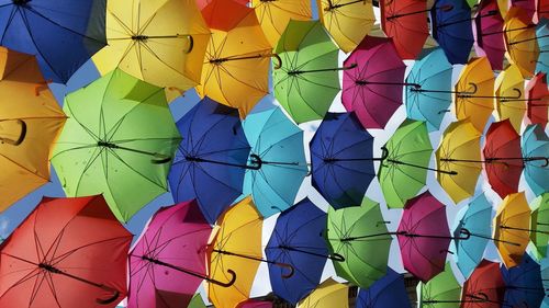 Full frame shot of multi colored umbrellas hanging on clothesline