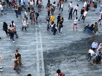 High angle view of people walking on road