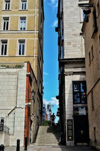 People in city against sky