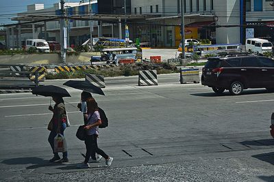 People walking on street in city