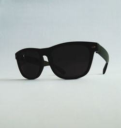 Close-up of sunglasses against white background
