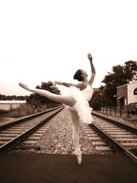 Full length of woman standing on wall