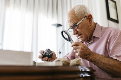 Man looking at camera on table