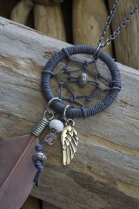 Close-up of dreamcatcher on table